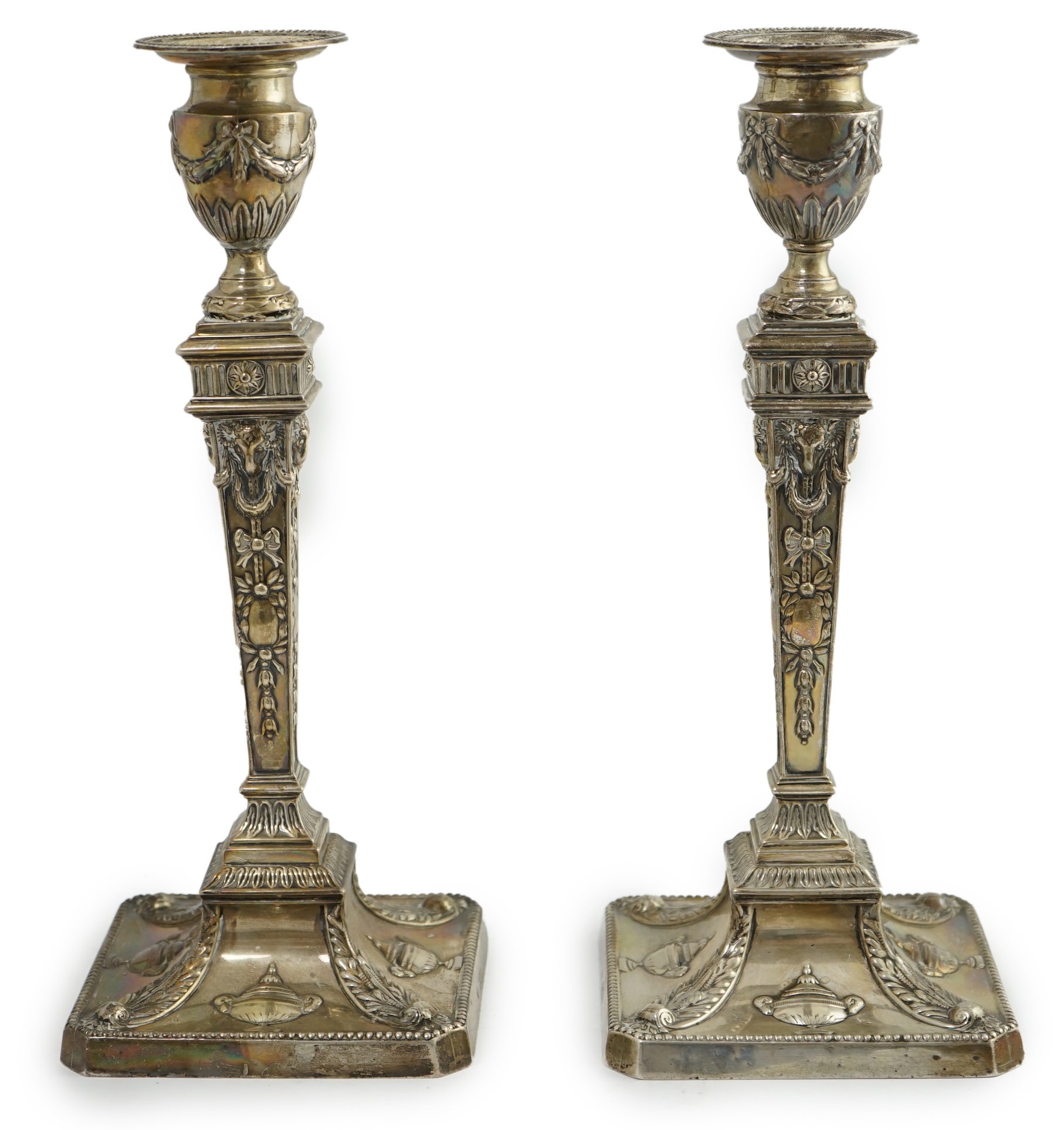 A pair of late Victorian silver Adam style candlesticks, by William Hutton & Sons, (a.f.)